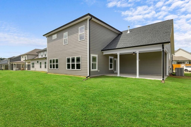 9676 Mayfly Rd # 10, Ooltewah, TN 37363 - back of house featuring a patio, a yard, and a shingled roof