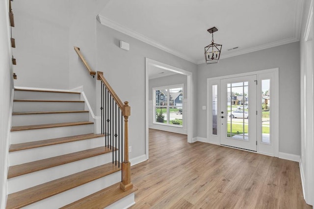 9676 Mayfly Rd # 10, Ooltewah, TN 37363 - foyer featuring light wood-type flooring, stairs, and ornamental molding