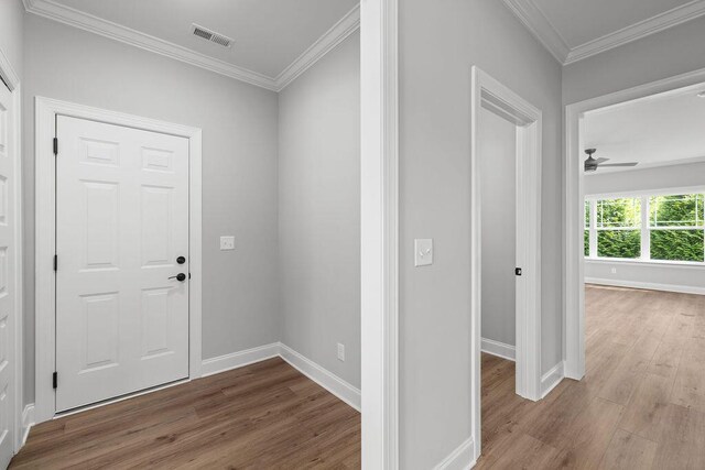 9676 Mayfly Rd # 10, Ooltewah, TN 37363 - entrance foyer featuring wood finished floors, a ceiling fan, and crown molding