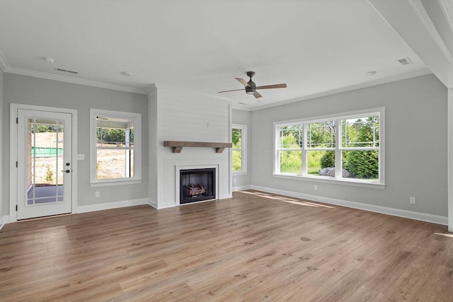 9676 Mayfly Rd # 10, Ooltewah, TN 37363 - unfurnished living room with a ceiling fan, healthy amount of natural light, wood finished floors, ornamental molding, and a large fireplace