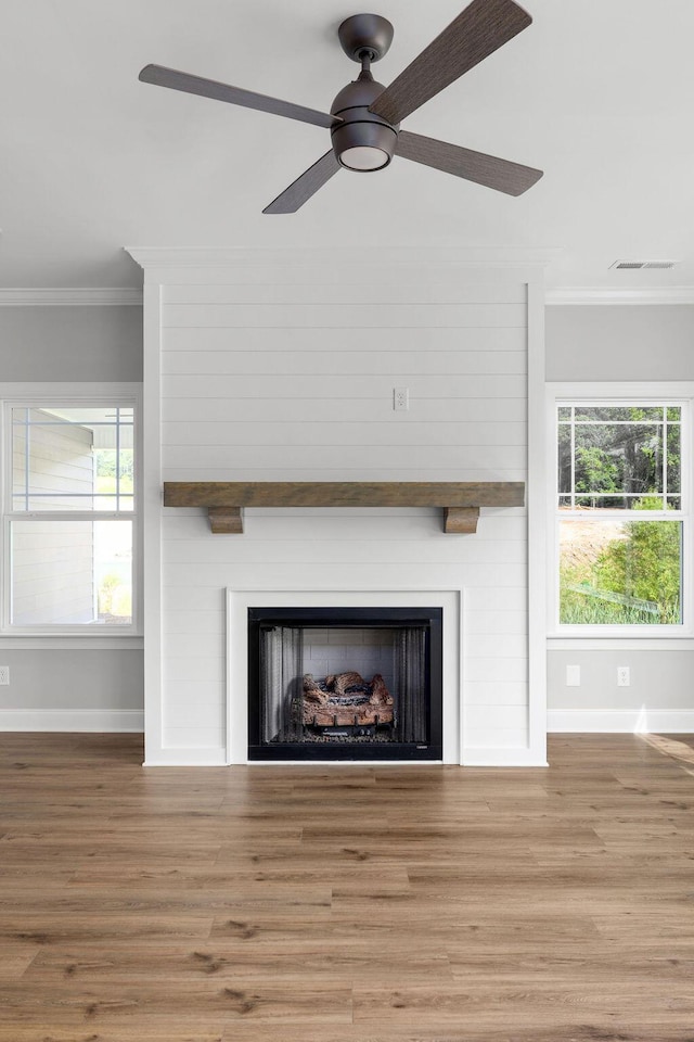 9676 Mayfly Rd # 10, Ooltewah, TN 37363 - detailed view of a fireplace, ornamental molding, a ceiling fan, and wood finished floors