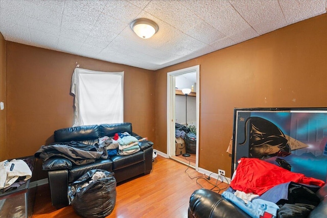 living room featuring baseboards and wood finished floors