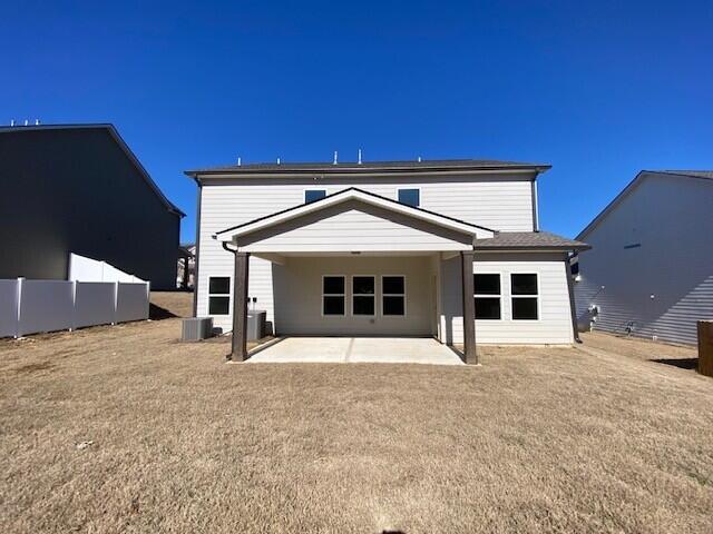 back of house with a patio area, fence, and central AC