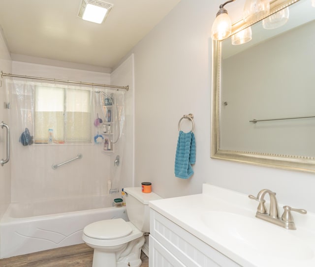 full bath with bathtub / shower combination, vanity, toilet, and wood finished floors