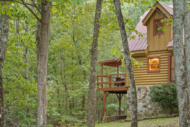 view of play area featuring a wooded view