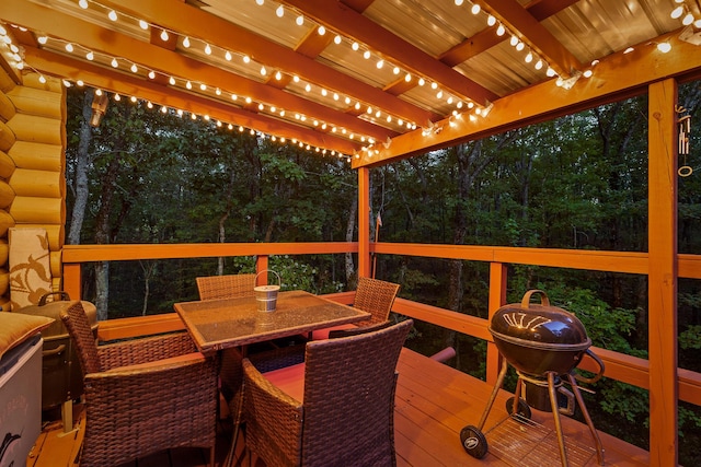 deck with outdoor dining area, a grill, and a pergola