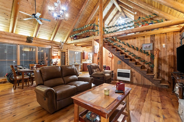 living area with stairs, hardwood / wood-style flooring, wood ceiling, and heating unit