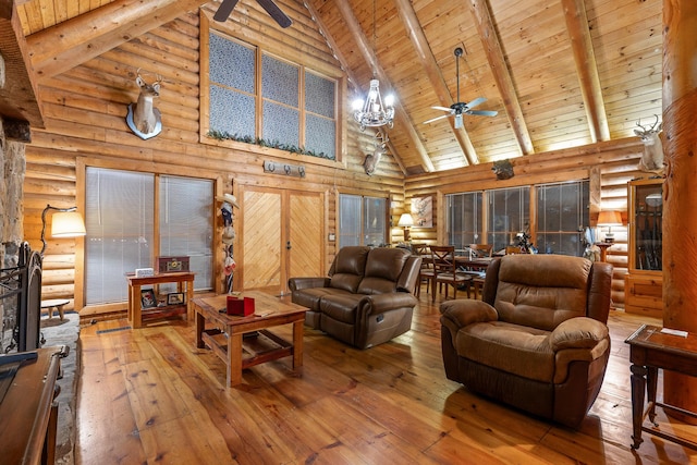 living area with wooden ceiling, hardwood / wood-style flooring, ceiling fan, and beam ceiling