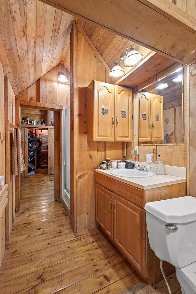 bathroom with wooden ceiling, wood walls, and vaulted ceiling