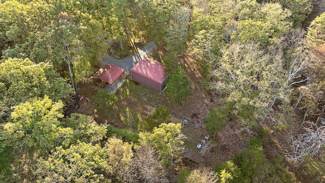 birds eye view of property with a wooded view