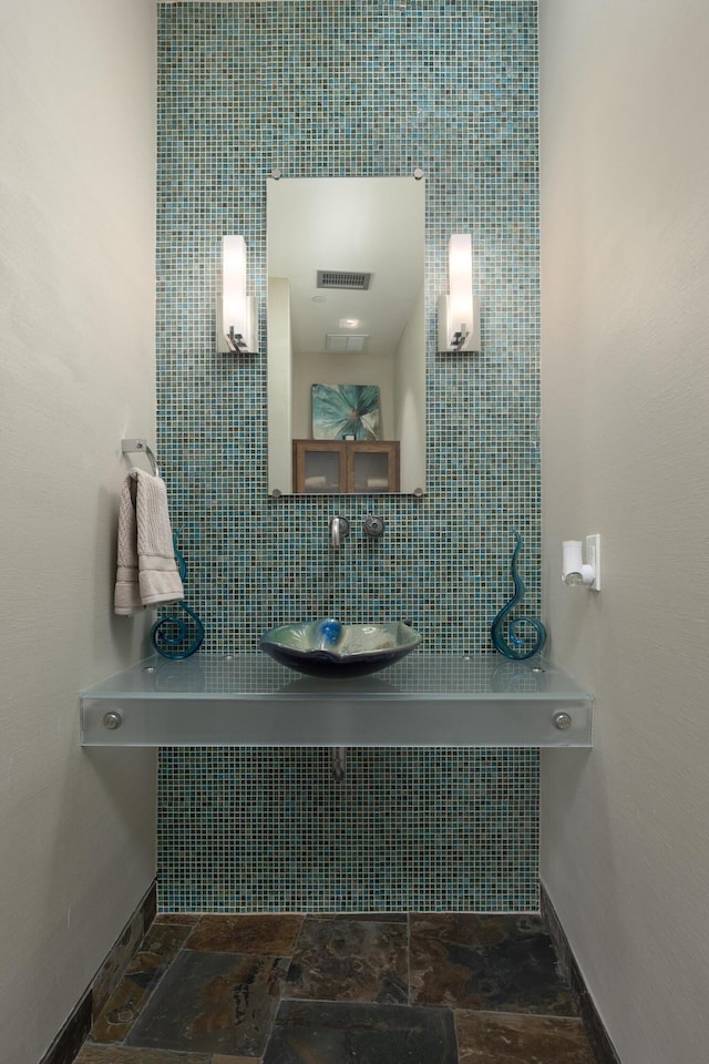 191 Chestnut St Unit 602, Chattanooga, TN 37402 - bathroom featuring tasteful backsplash and stone finish flooring