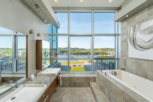 191 Chestnut St Unit 602, Chattanooga, TN 37402 - full bathroom featuring a water view, a whirlpool tub, expansive windows, and double vanity