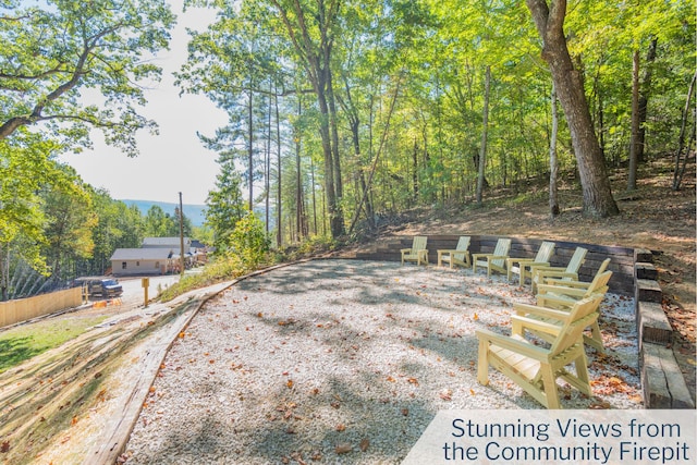 view of street featuring a wooded view