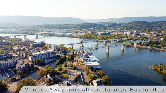 bird's eye view with a water and mountain view