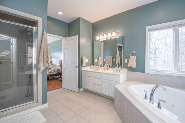 full bath featuring tile patterned flooring, a sink, a shower stall, double vanity, and a tub with jets