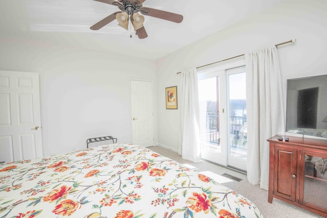 bedroom with light carpet, access to exterior, visible vents, and a ceiling fan