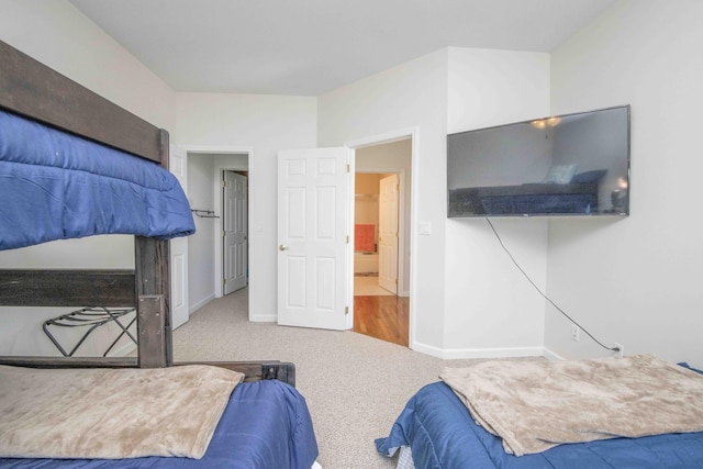 bedroom featuring carpet flooring and baseboards