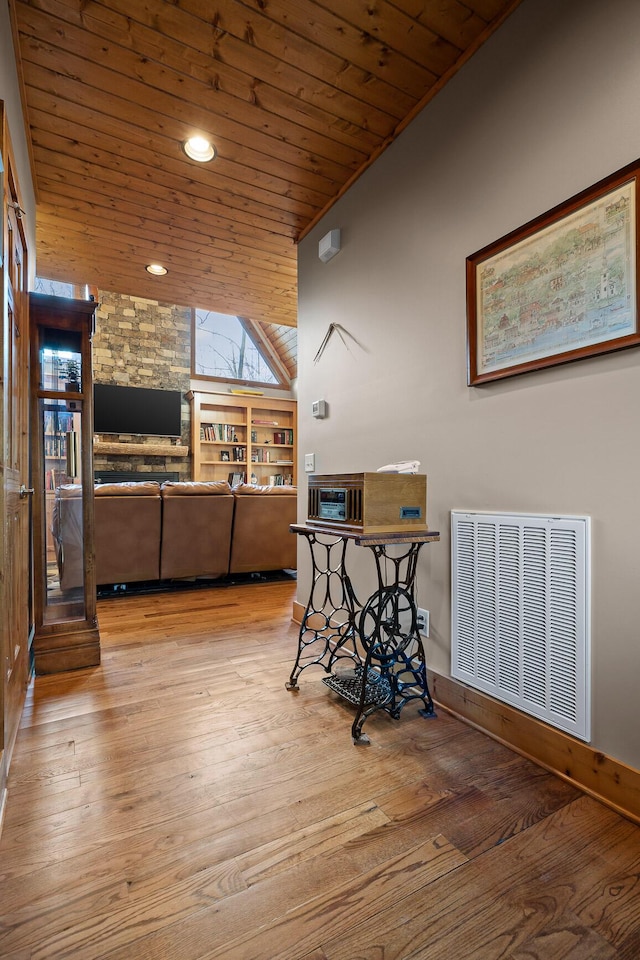 dining area featuring lofted ceiling, recessed lighting, visible vents, wood finished floors, and wooden ceiling