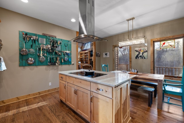 kitchen featuring light brown cabinets, black electric cooktop, island range hood, dark wood-type flooring, and a kitchen island