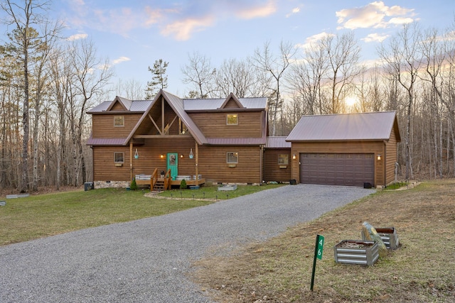 chalet / cabin featuring crawl space, metal roof, a front lawn, and gravel driveway