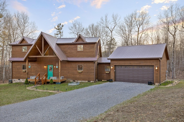 view of front of property featuring metal roof, a garage, driveway, crawl space, and a front yard