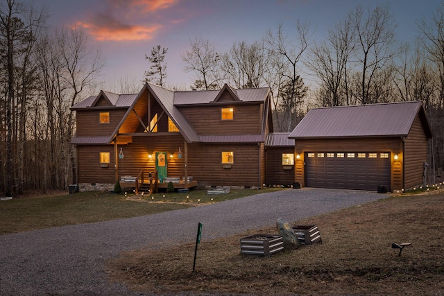 view of front of property with aphalt driveway, a yard, crawl space, a garage, and faux log siding