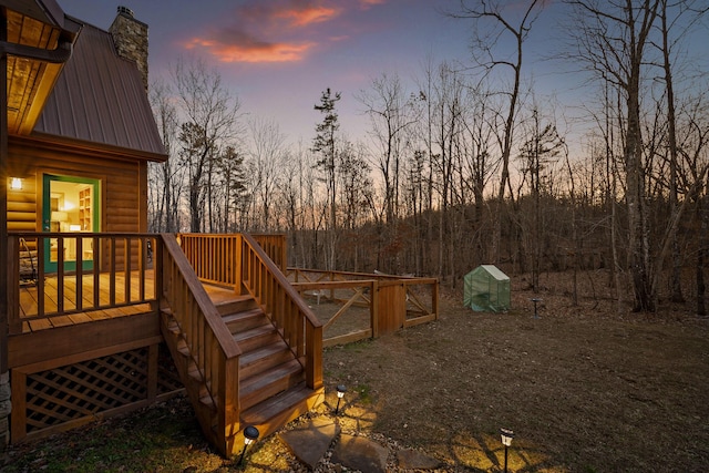 yard at dusk with a deck