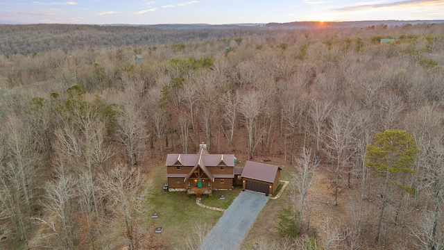 drone / aerial view featuring a view of trees