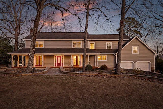 view of front of home featuring a garage and a chimney