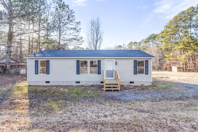 view of front of property featuring crawl space, a shingled roof, and entry steps