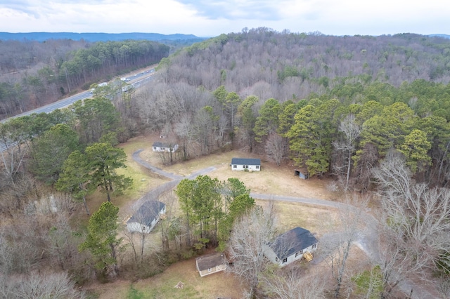 birds eye view of property with a wooded view