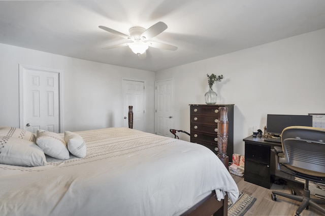 bedroom with ceiling fan and light wood-style flooring