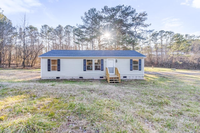 manufactured / mobile home featuring crawl space and roof with shingles