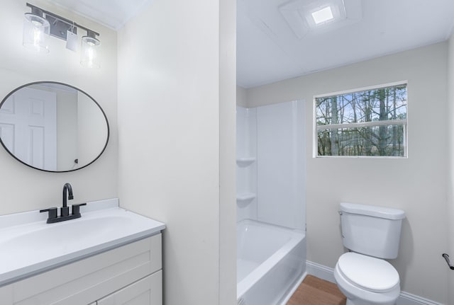 full bathroom featuring toilet, baseboards, wood finished floors, and vanity