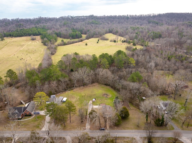 bird's eye view featuring a forest view