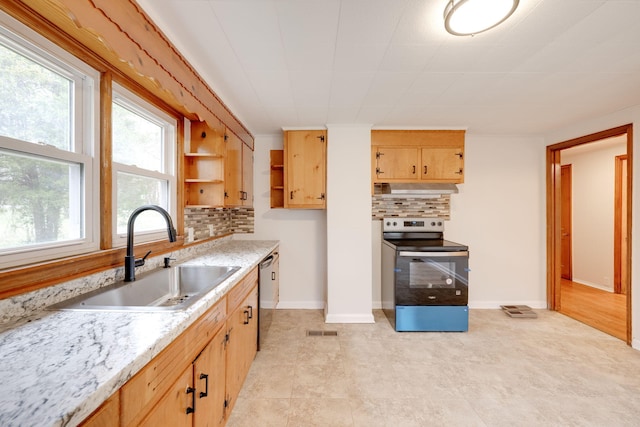 kitchen featuring light brown cabinets, a sink, appliances with stainless steel finishes, decorative backsplash, and open shelves