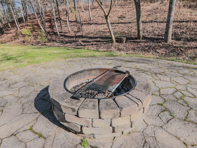 view of patio featuring an outdoor fire pit