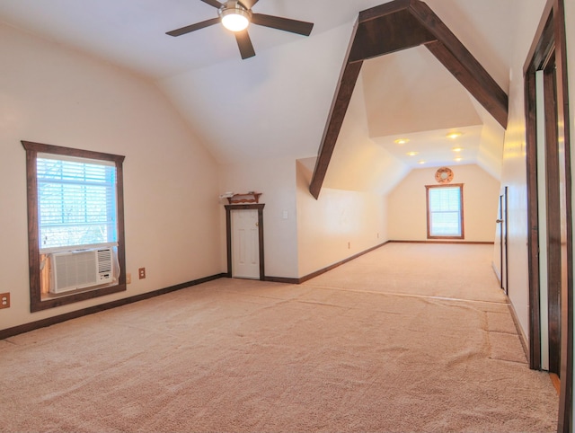 additional living space with vaulted ceiling, cooling unit, carpet flooring, and baseboards