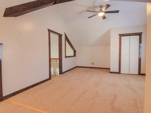 bonus room featuring carpet floors, lofted ceiling, baseboards, and a ceiling fan