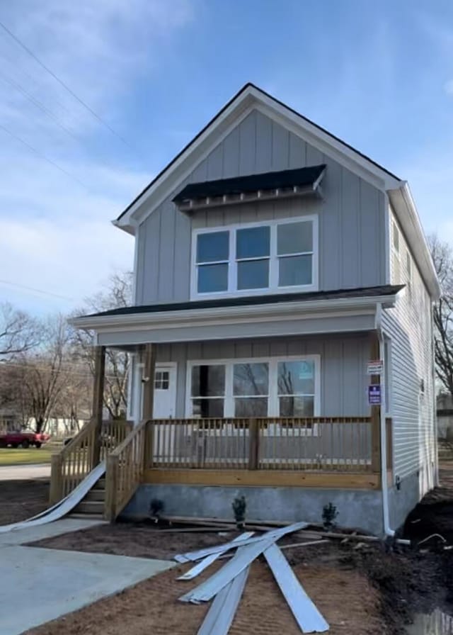 view of front of house with covered porch and board and batten siding