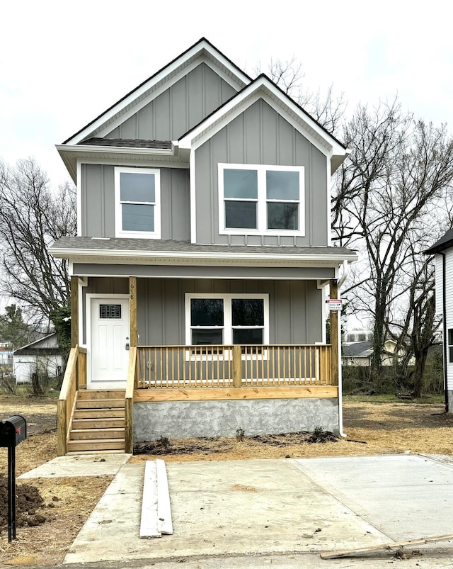 view of front of home featuring board and batten siding and covered porch