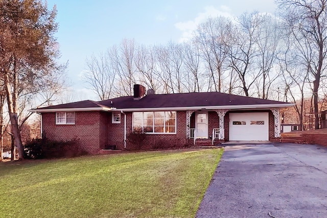 10050 Forest Dr, Ooltewah, TN 37363 - ranch-style house with a garage, brick siding, driveway, and a front yard