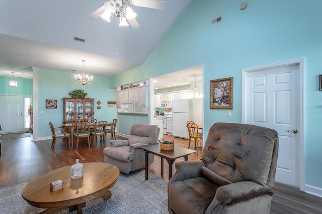 living room with high vaulted ceiling, visible vents, and wood finished floors