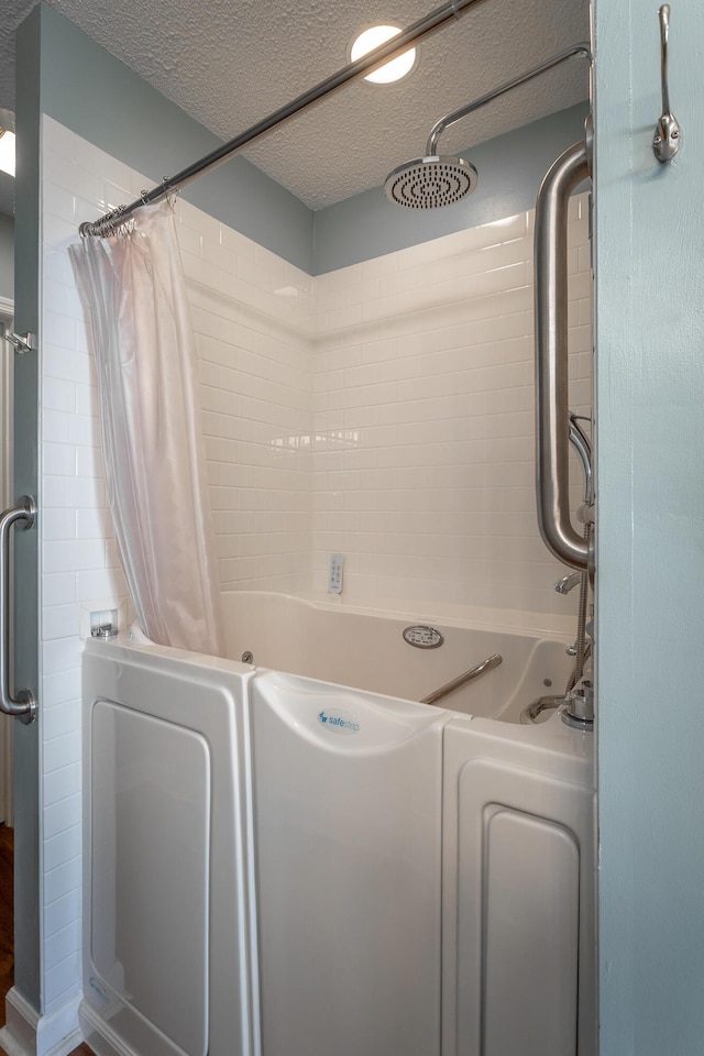 laundry room featuring a textured ceiling