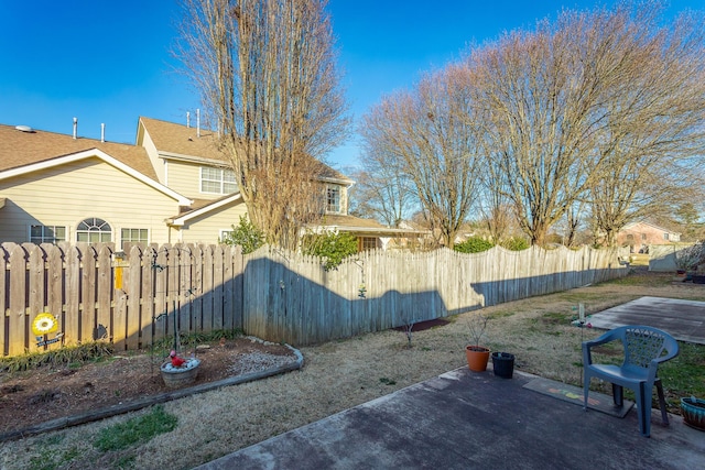 view of yard featuring a patio and fence