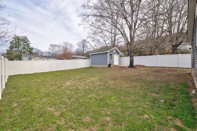 view of yard featuring an outbuilding and a fenced backyard