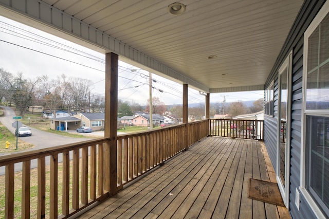 wooden deck with a residential view