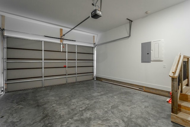 garage featuring baseboards, electric panel, and a garage door opener