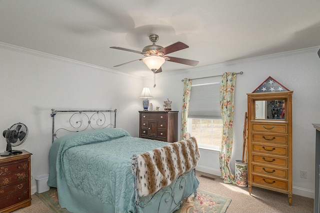 bedroom featuring visible vents, baseboards, ceiling fan, ornamental molding, and carpet floors