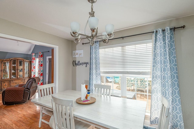 dining room with an inviting chandelier and wood finished floors